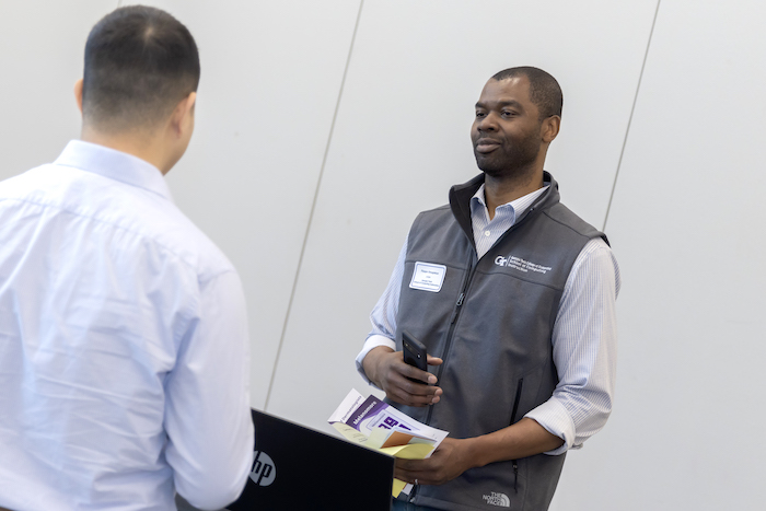 Georgia Tech School of Computing Instruction Inaugural Chair Olufisayo Omojokun speaking with a student