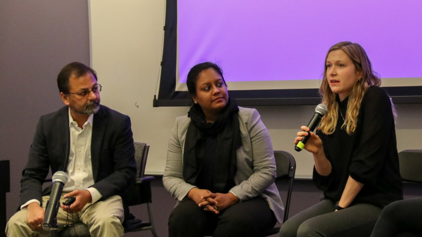 Panelists talking during event