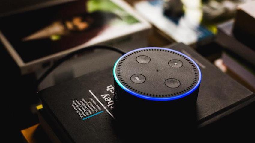 An Amazon Alexa sits on top of a table